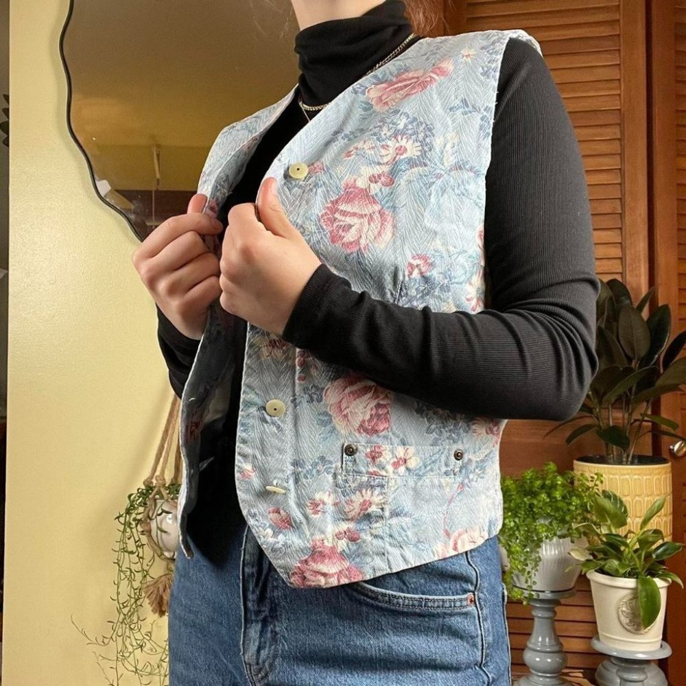 Vintage denim vest with floral and plaid patterns.